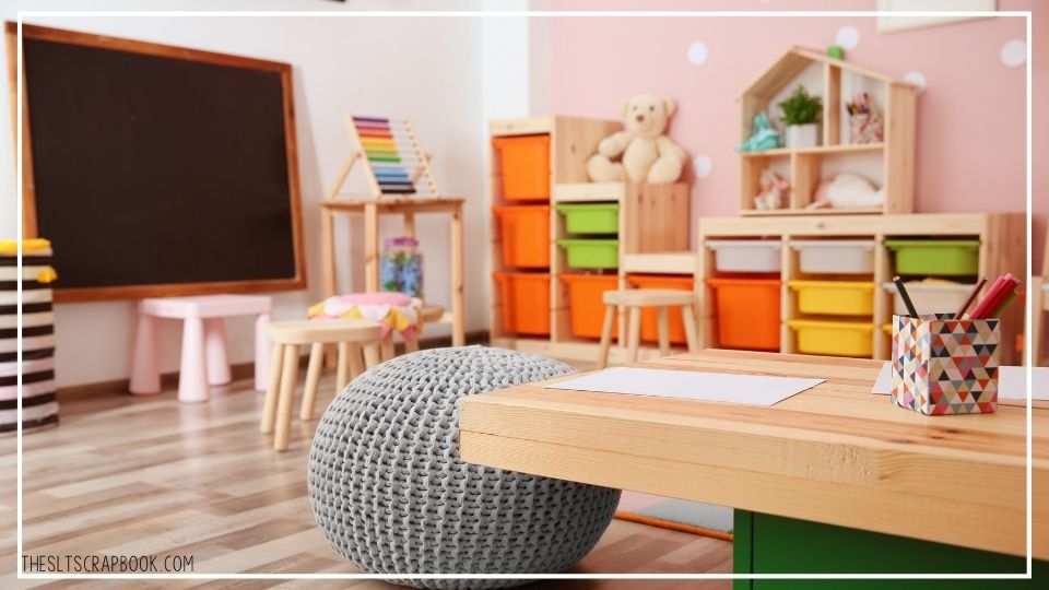 Picture of a playroom or SLP therapy room neatly organised with a range of toy rotation storage options.